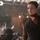 Laura Donnelly in a brown and black Victorian dress as Amalia True standing next to some scientific contraption in HBO's The Nevers.